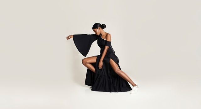 Model Posing in Black Dress
